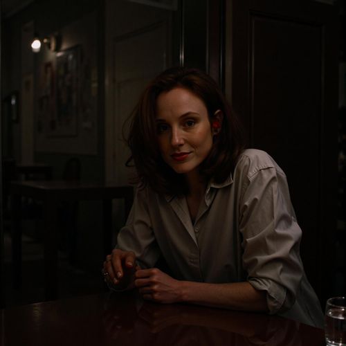 Showcase image for Mobster - Prompt: a photo of me WOMAN in a dimly lit backroom, medium shot, leaning over a table as if in a secret negotiation, film noir style. WOMAN with a serious, calculating expression.