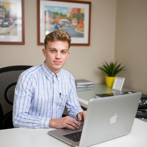 Showcase image for My Desk Shot - Prompt: a photo of me MAN seated at their clean, organized desk, medium shot, looking directly at the camera. MAN looking focused and efficient.