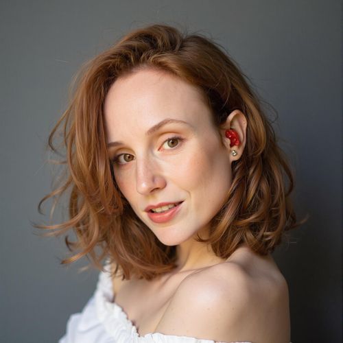 Showcase image for Iconic Portrait - Prompt: a photo of me WOMAN in a classic, iconic celebrity portrait style, close-up, simple background, focusing on expressive eyes and timeless appeal. WOMAN looking unforgettable.