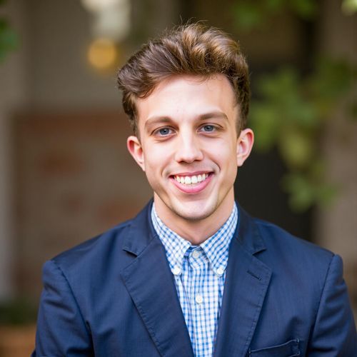 Showcase image for First-Time Buyer Friendly - Prompt: a photo of me MAN, friendly real estate agent, medium shot, exceptionally warm and reassuring smile, soft lighting. MAN looking very approachable.