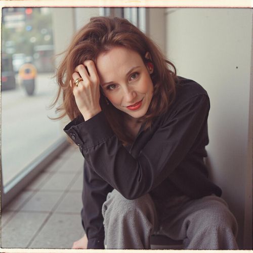 Showcase image for Success Portrait - Prompt: a photo of me WOMAN for a magazine cover, half body shot, looking powerful and successful. WOMAN with a direct, confident gaze.