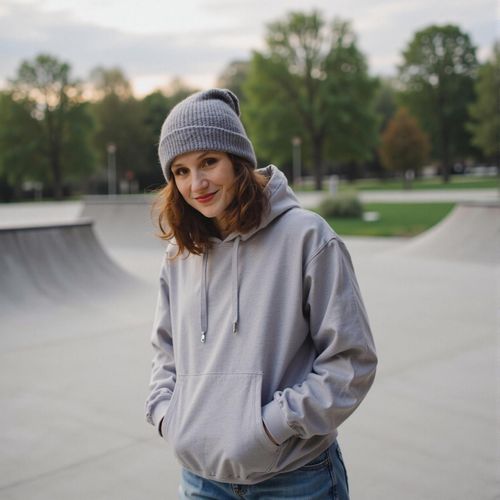 Showcase image for Skater Style - Prompt: a photo of me WOMAN in skater-style clothing (e.g. hoodie, beanie), half body shot, at a skatepark. WOMAN looking cool and relaxed.