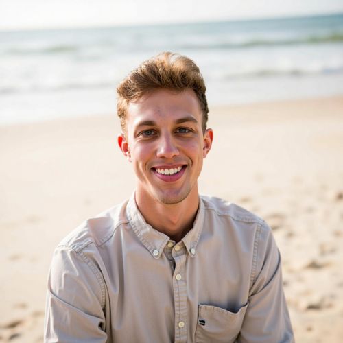 a photo of me MAN at the beach, medium closeup, casual beachwear, friendly smile, sandy shore background, natural sunlight, ocean waves visible. MAN looking at the camera.