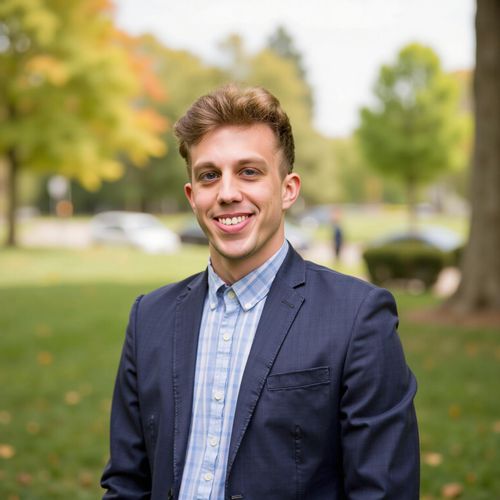 Showcase image for Local Expert - Prompt: a photo of me MAN, real estate agent headshot, medium shot, with a subtly blurred background of a charming local park. MAN looking like a community expert.