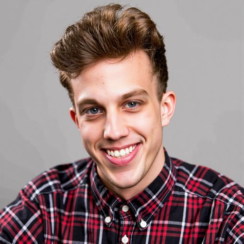 Showcase image for Comedic Shot - Prompt: a photo of me MAN, comedic actor headshot, medium close-up, with a wide, infectious laugh, bright lighting. MAN looking genuinely amused.