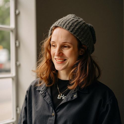 Showcase image for Post-Talk Power Shot - Prompt: a photo of me WOMAN backstage after a keynote, medium shot, looking confident and pleased, slight smile of accomplishment. WOMAN exuding success.