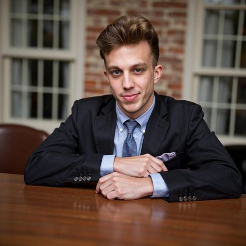a photo of me MAN at the head of a boardroom table, half body shot, looking like a decisive leader. MAN with a commanding presence.