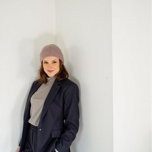 Showcase image for Modern Agent - Prompt: a photo of me WOMAN, modern real estate agent headshot, medium shot, stylish business casual attire, against a minimalist, bright background. WOMAN looking sharp and innovative.