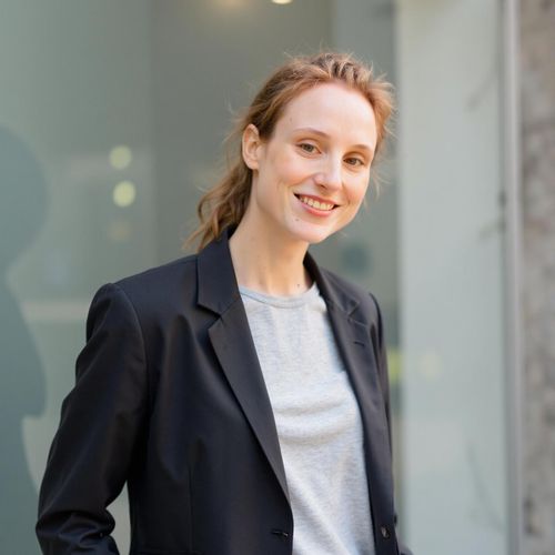 Showcase image for Modern Agent - Prompt: a photo of me WOMAN, modern real estate agent headshot, medium shot, stylish business casual attire, against a minimalist, bright background. WOMAN looking sharp and innovative.
