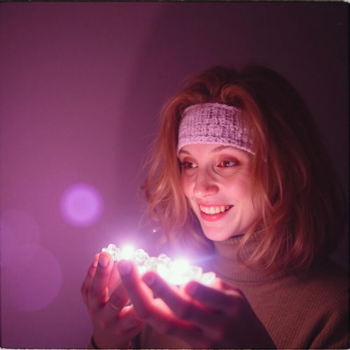 Showcase image for Mystical & Esoteric - Prompt: a photo of me WOMAN holding a glowing crystal, close-up, with a look of wonder. WOMAN with a magical aura.
