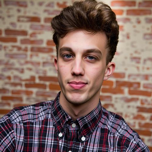 a photo of me MAN in artistic attire, medium close-up shot, against a textured unique background, showing individuality. MAN with an engaging, creative expression.