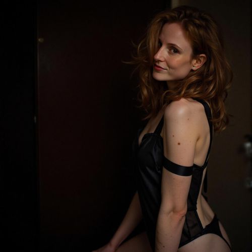 Showcase image for Dramatic Edge - Prompt: a photo of me WOMAN in dark lingerie or bodysuit, medium shot, chiaroscuro lighting, empowering pose. WOMAN looking intensely at the camera.