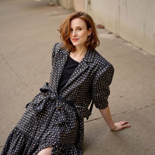 Showcase image for Editorial Chic - Prompt: a photo of me WOMAN in an avant-garde outfit, medium shot, artistic pose, fashion magazine editorial style. WOMAN with a strong, expressive look.