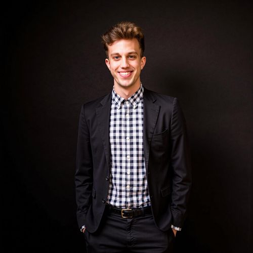 Showcase image for Post-Talk Power Shot - Prompt: a photo of me MAN backstage after a keynote, medium shot, looking confident and pleased, slight smile of accomplishment. MAN exuding success.