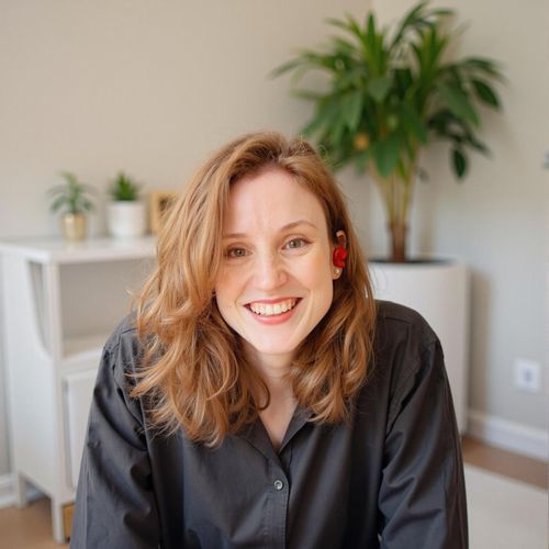 Showcase image for First-Time Buyer Friendly - Prompt: a photo of me WOMAN, friendly real estate agent, medium shot, exceptionally warm and reassuring smile, soft lighting. WOMAN looking very approachable.