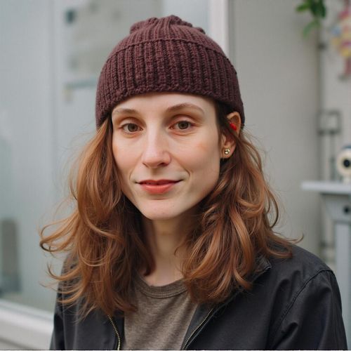 Showcase image for Character Actor - Prompt: a photo of me WOMAN, character actor headshot, medium shot, conveying a quirky, memorable personality, slightly unconventional attire. WOMAN with an intriguing expression.