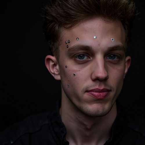 Showcase image for Cyborg - Prompt: a close-up portrait of me MAN with subtle cybernetic implants on their face, looking powerful. MAN with glowing optic nerves.